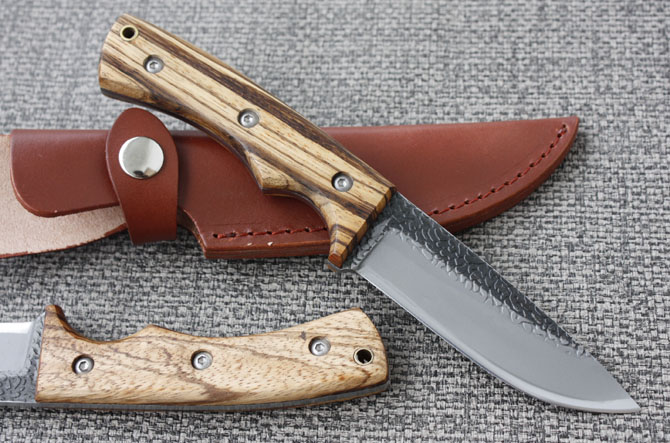 Small straight knife with wooden handle
